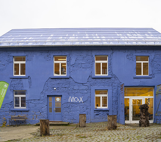 A blue house with white shutters.