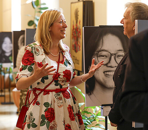 The Vice-Rector talks to a guest at the event.