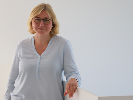 Ms. Almuth Müller smiles into the camera.