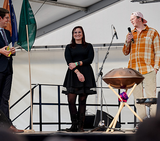 Three people on stage