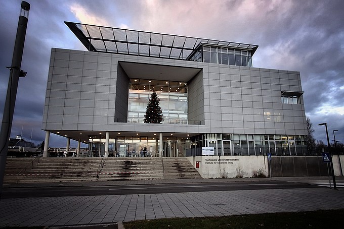 A TU Munich university building with a Christmas tree in the window