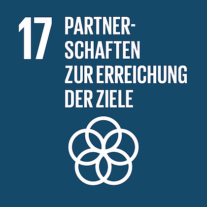 Icon von Sustainable Development Goal 17. In weißer Schrift steht vor dunkelblauem Hintergrund: Partnerschaften zur Erreichung der Ziele. Darunter befindet sich ein Symbol, welches fünf kreisförmig ineinandergreifende Ringe zeigt. 