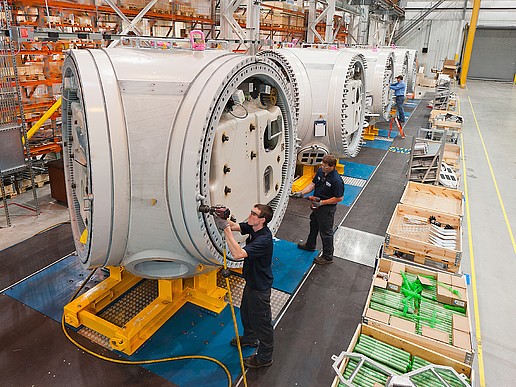 Production facility - people working on individual wind turbine components