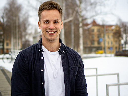 Franz Just on the Zittau campus, smiling into the camera.