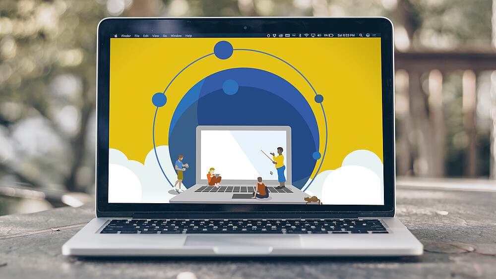 Laptop on which a graphic (laptop, people, clouds) is displayed.