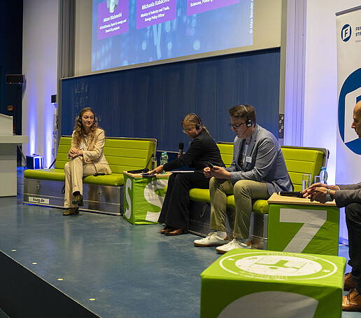 View of the stage with the panelists seated there