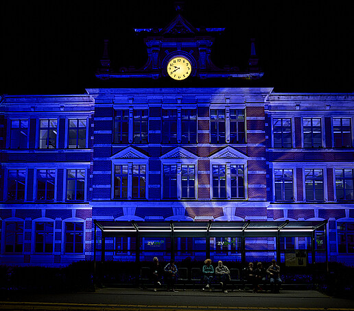 The park school is illuminated in blue.