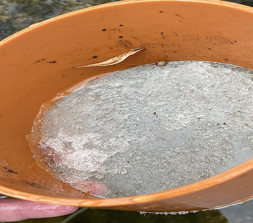 A bowl full of ice cream.