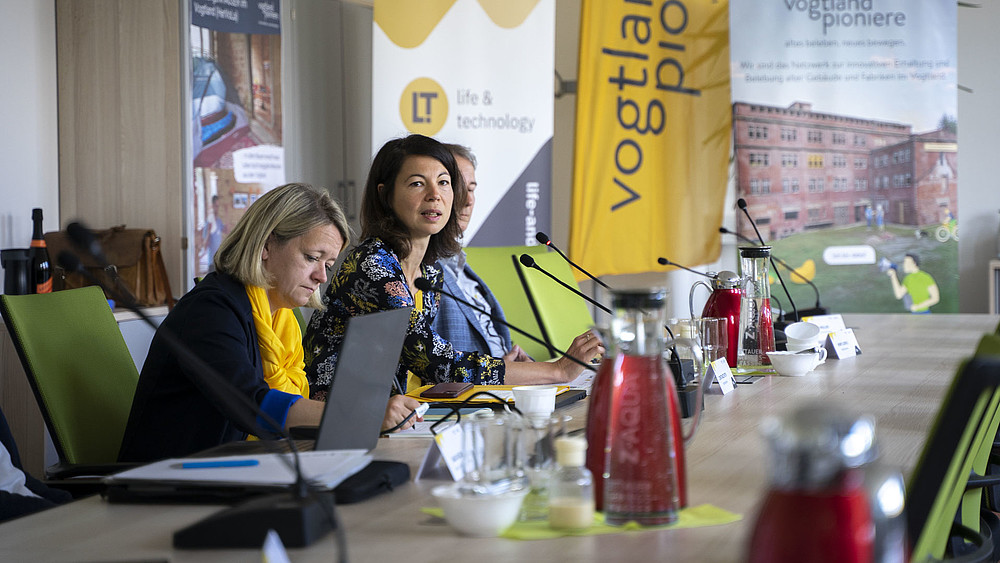 Participants in discussion at the table
