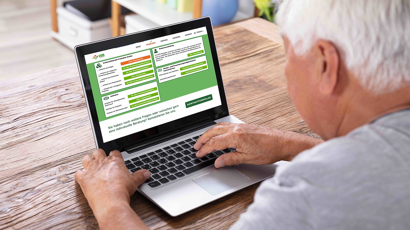 Elderly gentleman in front of laptop