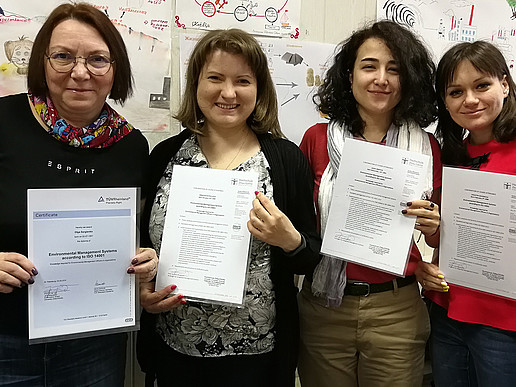 Four students from St. Petersburg hold their TÜV certificates in their hands