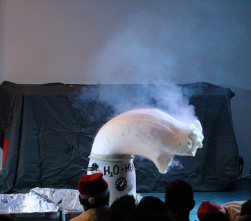 A thick foam sausage spills out of a barrel.