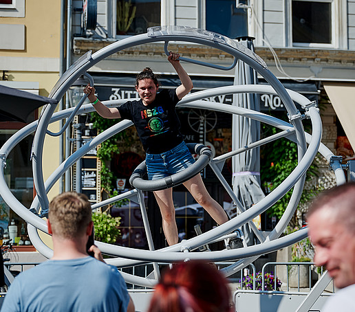 A visitor tries out a space device on the market square.