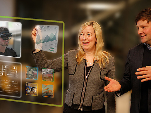 Professor Keil and Mr. Daniel Winkler interacting with a hologram on the topic of digital university teaching.