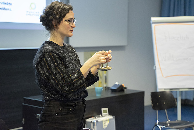 A woman tries out a device.