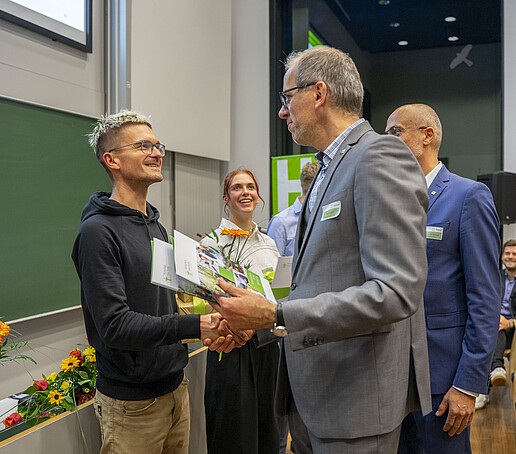 Mr. Linack congratulates an award winner.