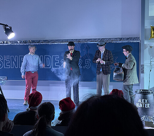 Actors talk in the fog.