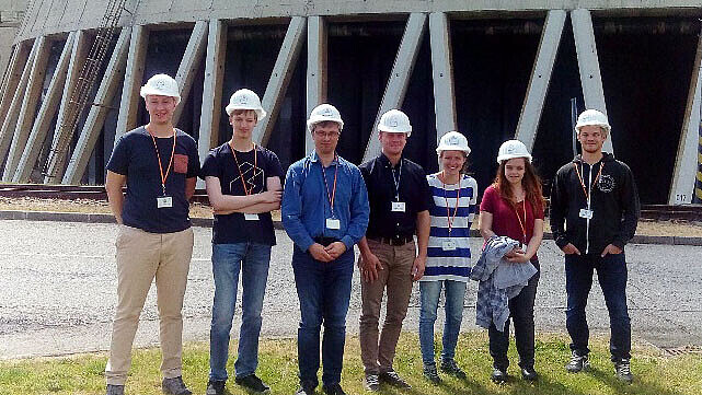 Group photo in front of one of the wet cooling towers