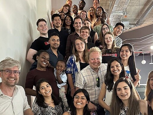 a group of very many people lined up on a staircase