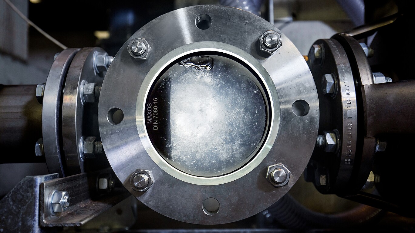 A sight glass in which water can be seen after reaching the triple point.