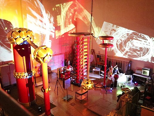 Musicians in the illuminated high-voltage hall