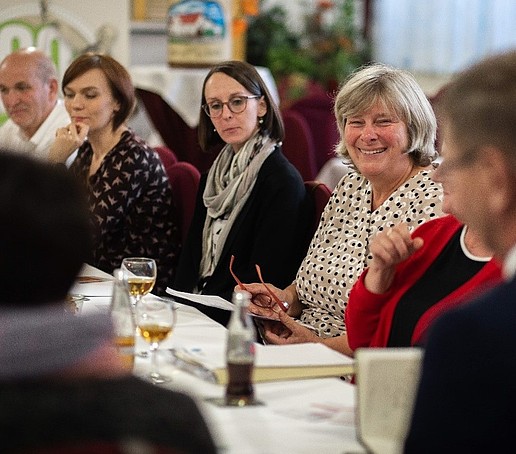 A group of storytellers sit together and tell stories.