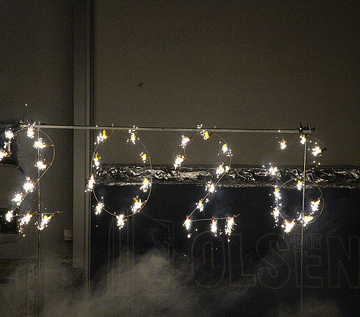 Fireworks consisting of the number 2026 light up the stage.