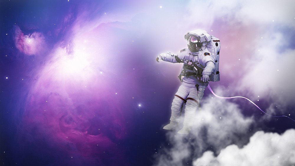 An astronaut floats through space.