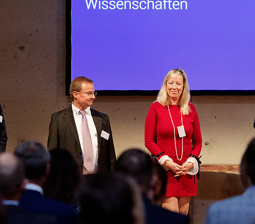 Four guests on stage, including the Vice Rector