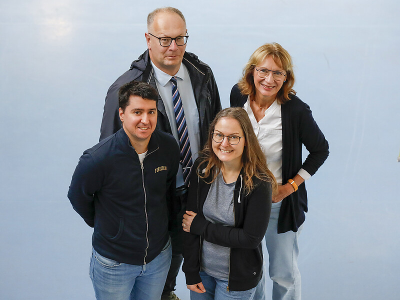 The project team stands in the foyer of House Z IV and looks up into the camera.