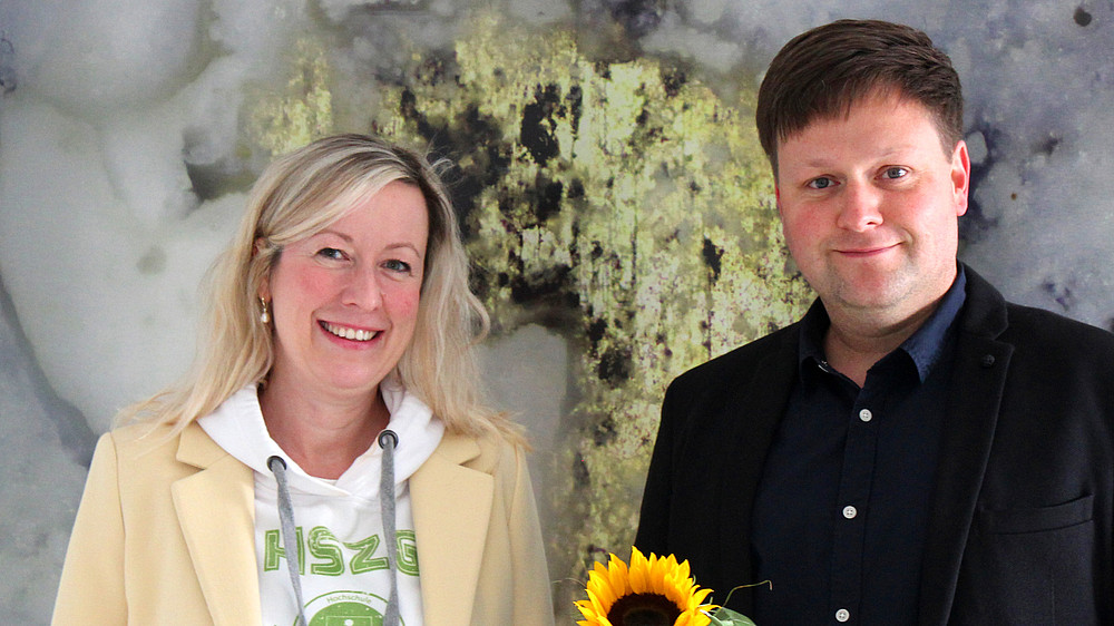 Professor Sophia Keil and Daniel Winkler smile into the camera.