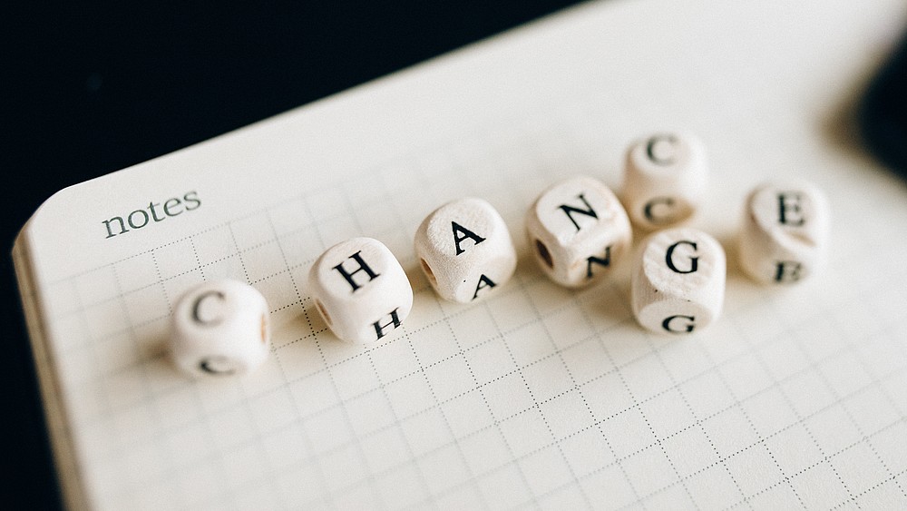 Dice lettering results in the English word Change