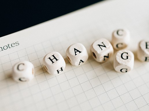 Dice lettering results in the English word Change
