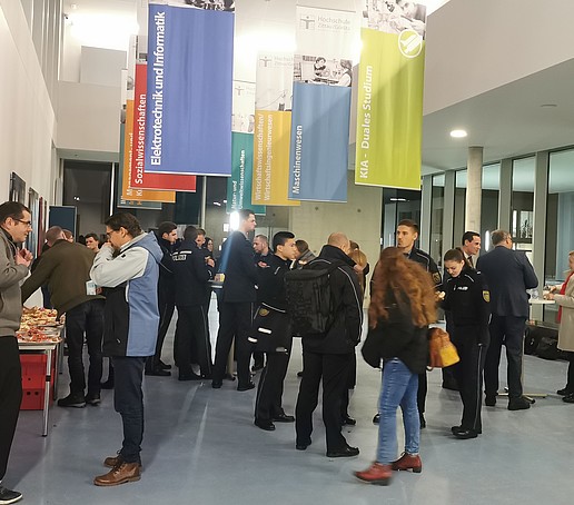 Come-together in the foyer of the lecture hall building with drinks and snacks.