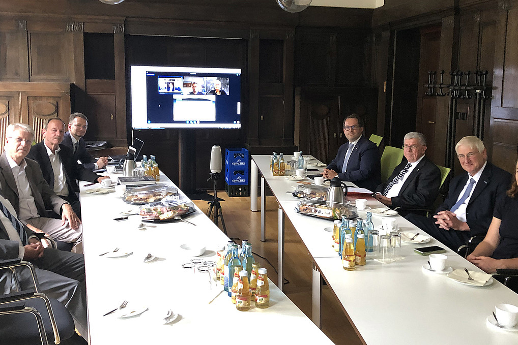 The ERIS Advisory Board sits in a meeting room at the HSCG.