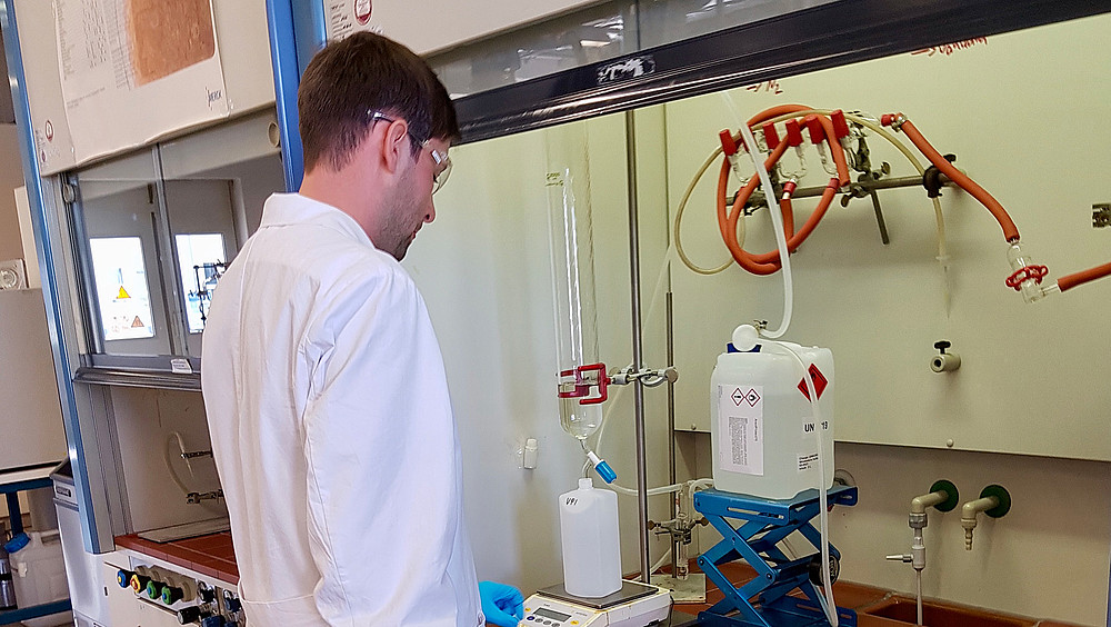 Man in a white coat in the lab