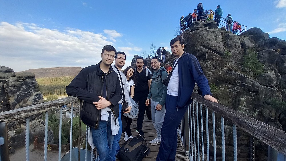 International students stand on a viewing platform in the Zittau Mountains.