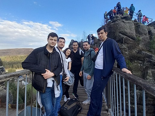 International students stand on a viewing platform in the Zittau Mountains.
