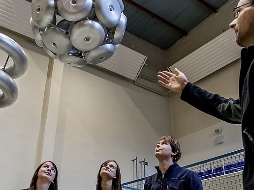 High-voltage laboratory in Zittau; professor explains a model to students