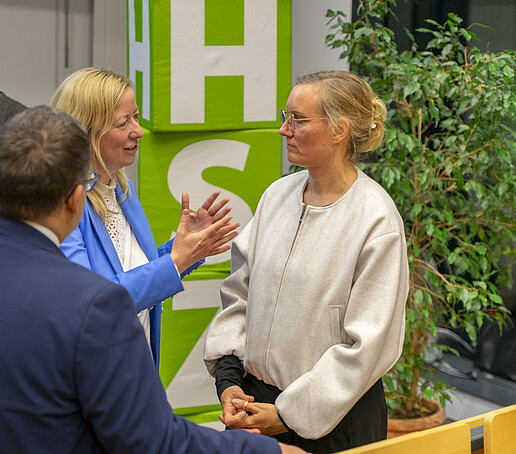 The Rector and the Vice President in conversation with a guest.