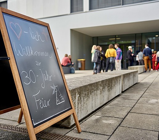 Exterior of the lecture hall with advertising sign