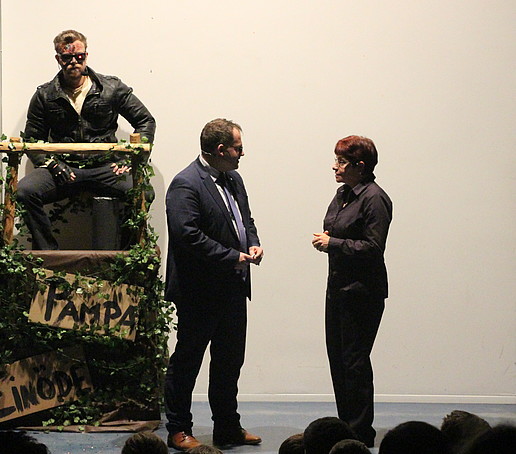 Rector and Chancellor on stage. The Terminator sits in the background.