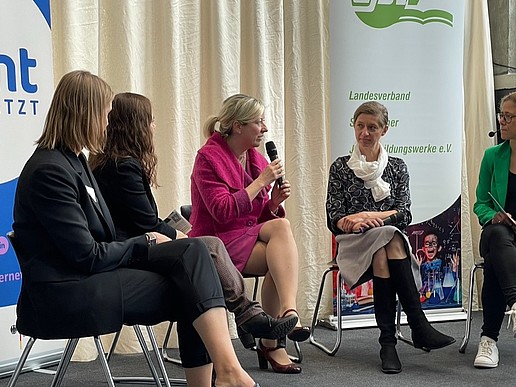 The Vice-Rector sits in a semi-circle in a panel discussion with STEM representatives