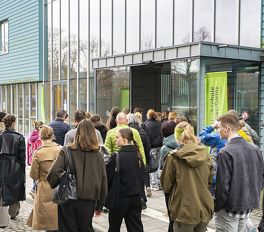 Prospective students walk towards the entrance to House G one.