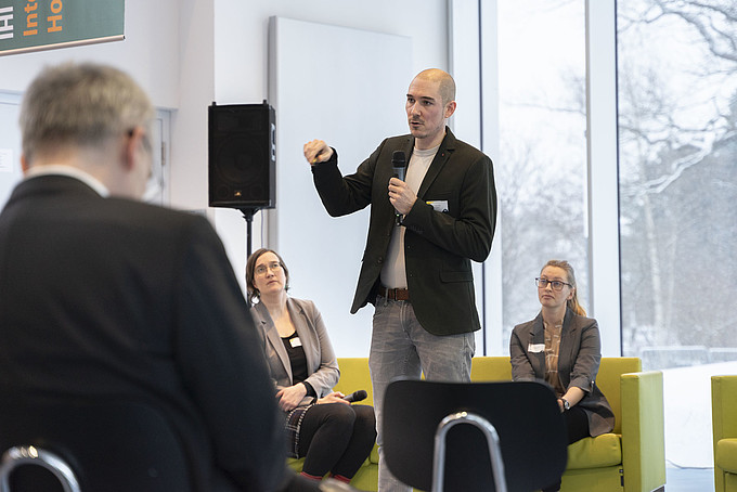 A speaker in front of an audience