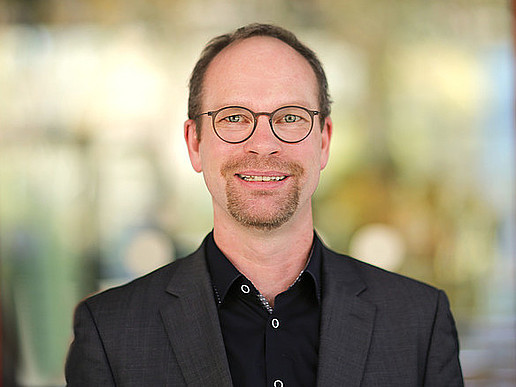 Prof. Hoff smiles into the camera.