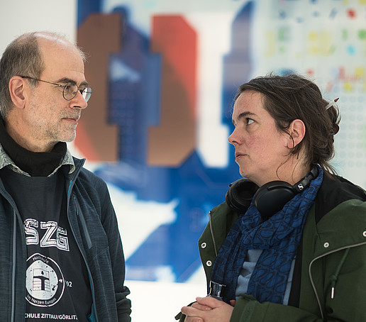 A man and a woman are talking.