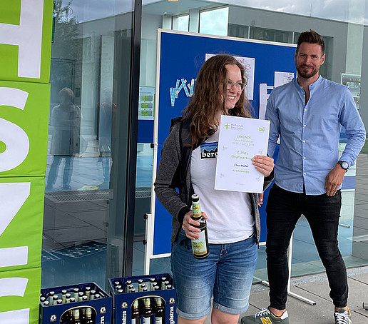 The only student participant in the bike challenge is delighted with her certificate.