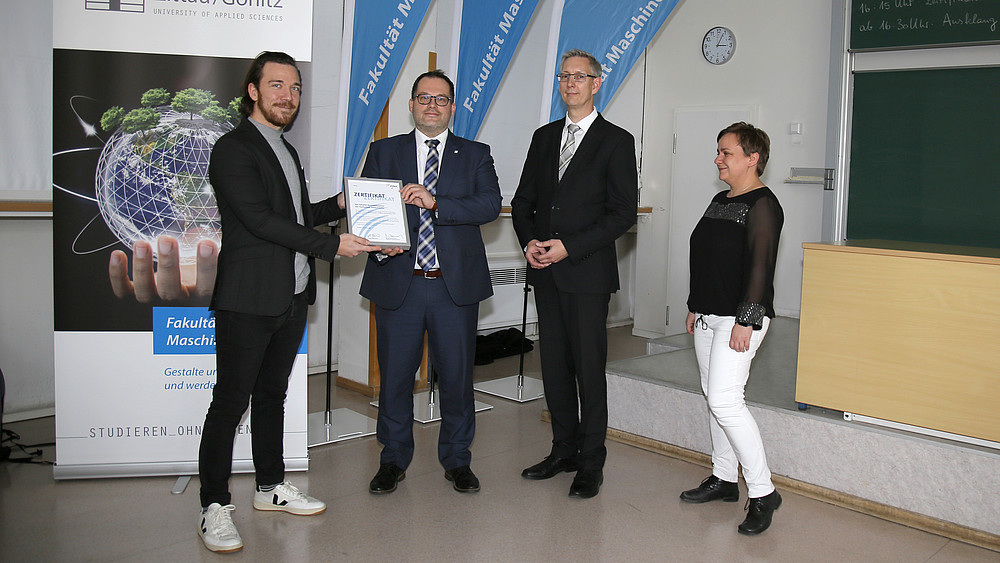 Group photo with certificate presentation