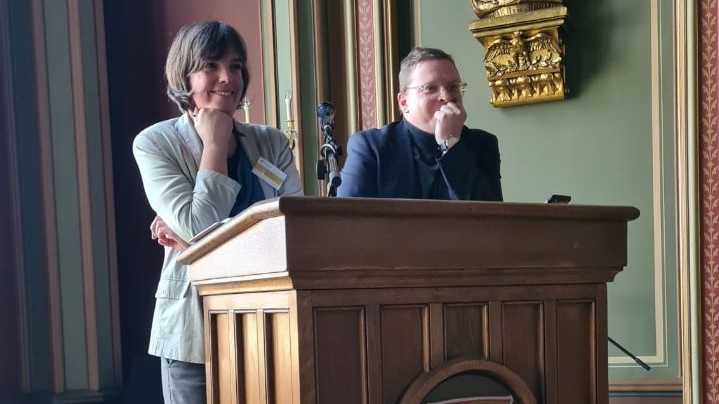 J. Gabler + M. Will at the lectern